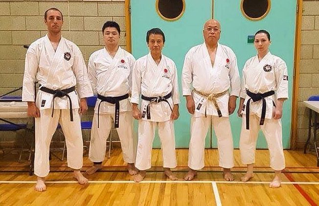 SKA Black belts Senpai Paul and Senpai Leanne with Sensei Nemoto 5th Dan JKA HQ Instructor, Sensei Kawasoe 7th Dan JKA UK and Sensei Mori 8th Dan from JKA Tokyo HQ.